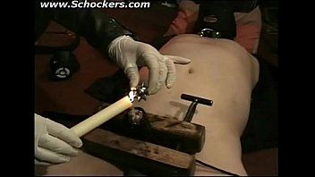 Dominatrix-bitch wearing latex squeezes 10-pounder and balls of bound serf in a dungeon sadomasochism